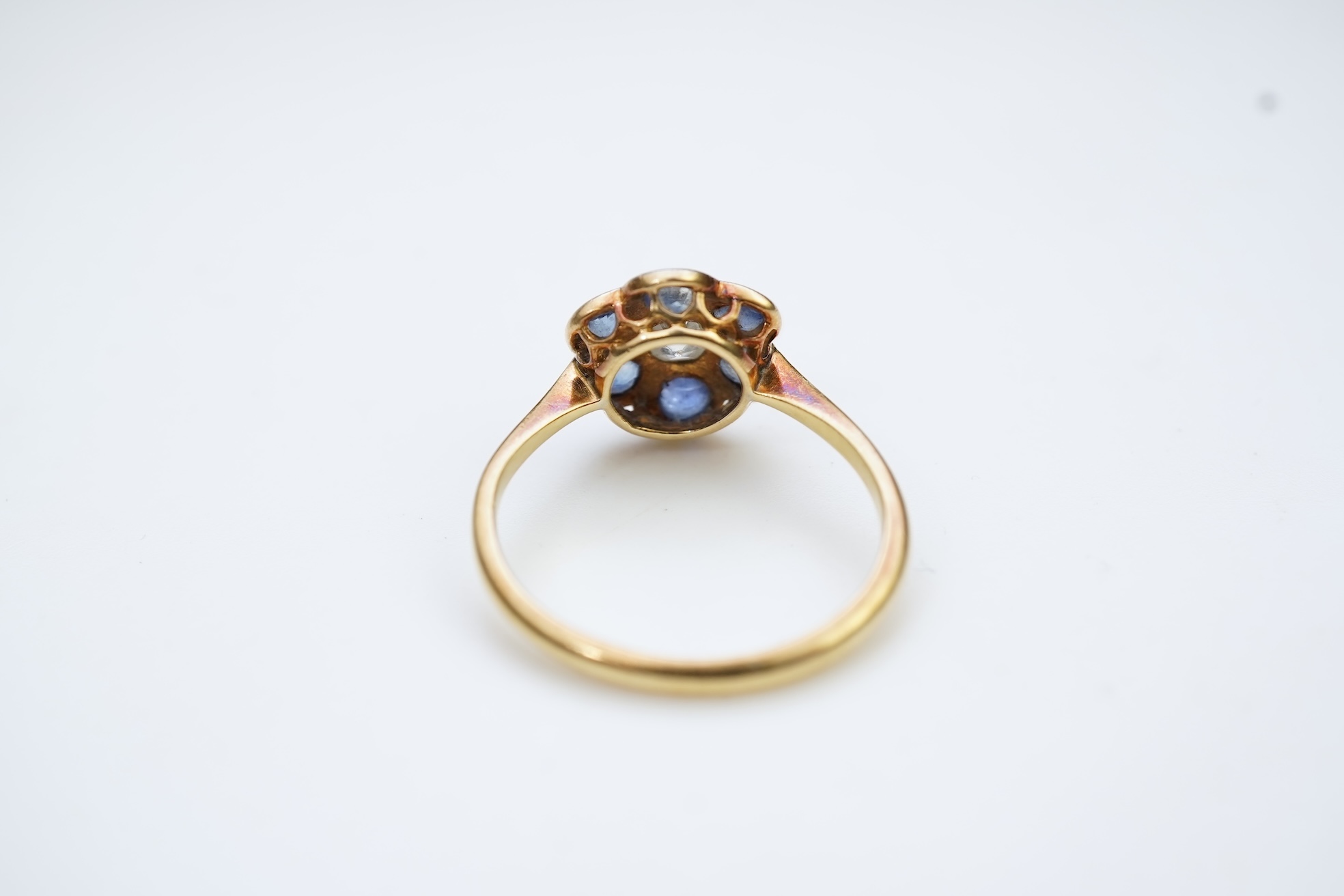 A sapphire and diamond cluster ring, early 20th century